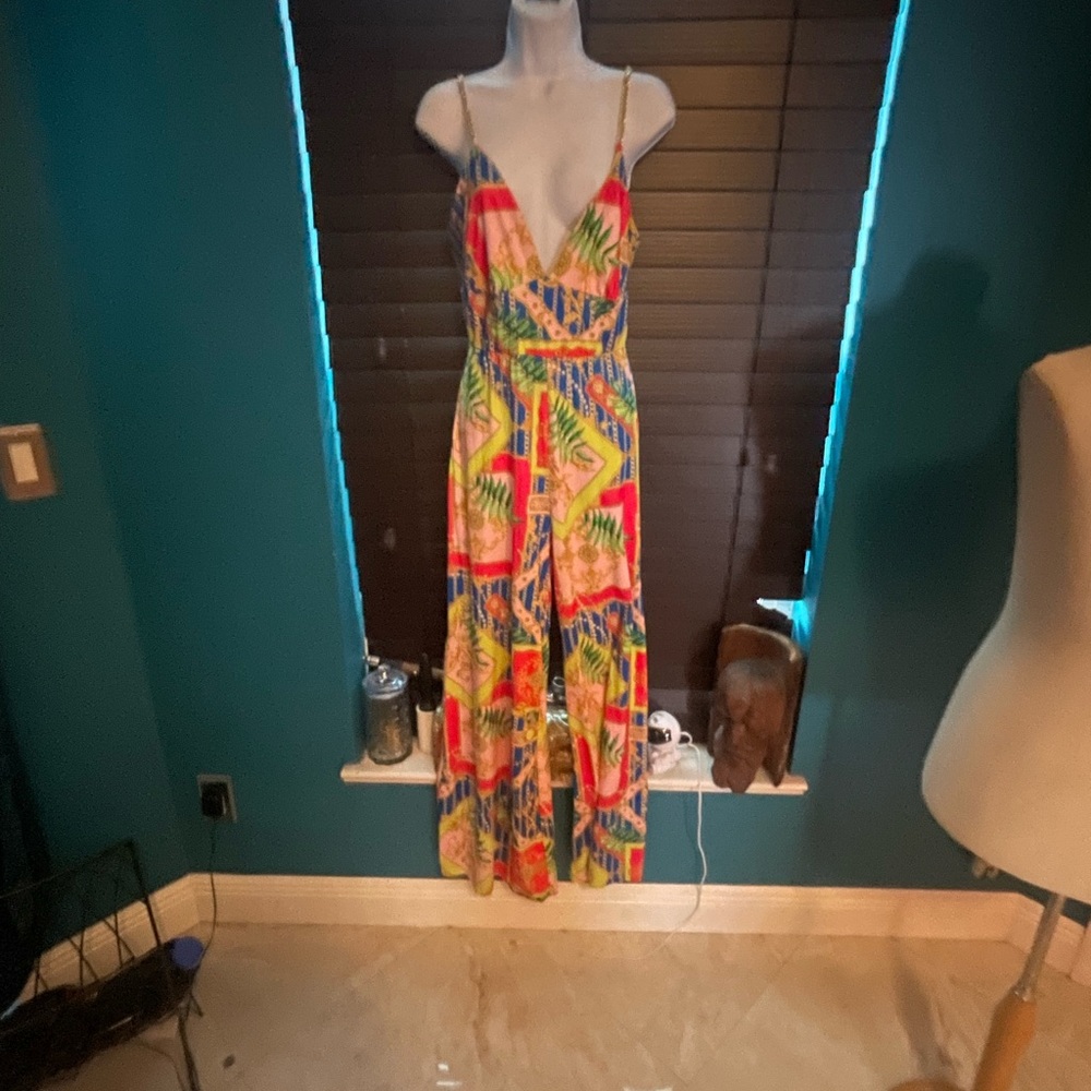 jumpsuit with gold chains for straps is body contouring, size L No Returns